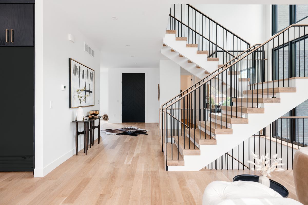 Entry hall and open staircase in a Caliber custom home