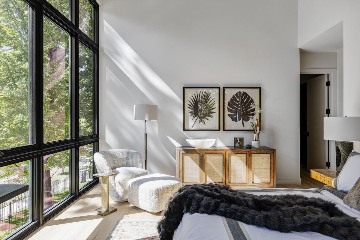 Sunlit primary bedroom in a Caliber custom home in Bonnie Brae