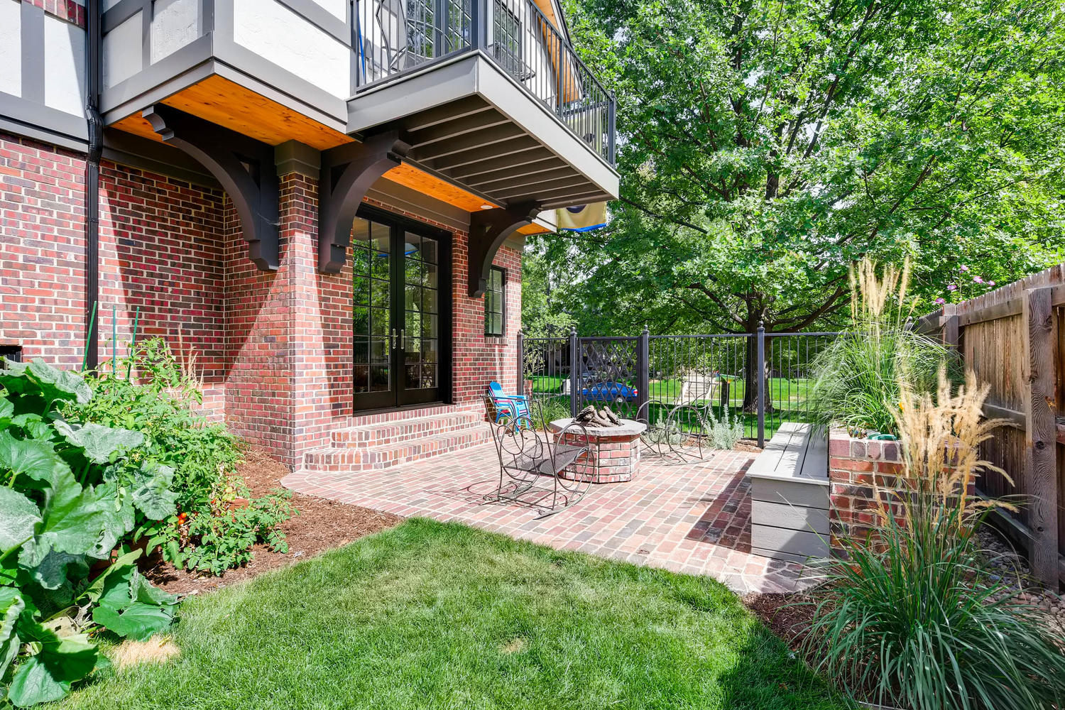 Covered back patio with fire pit at 1379 S Lafayette St
