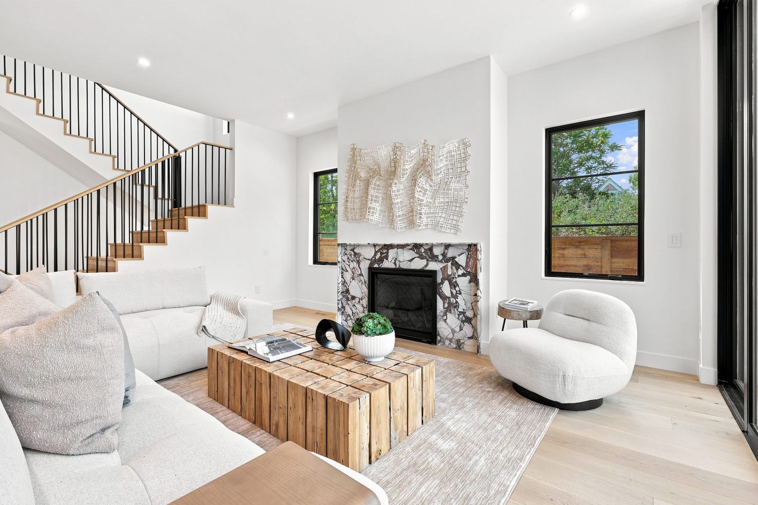 Open living room and staircase in a Caliber custom home in Denver
