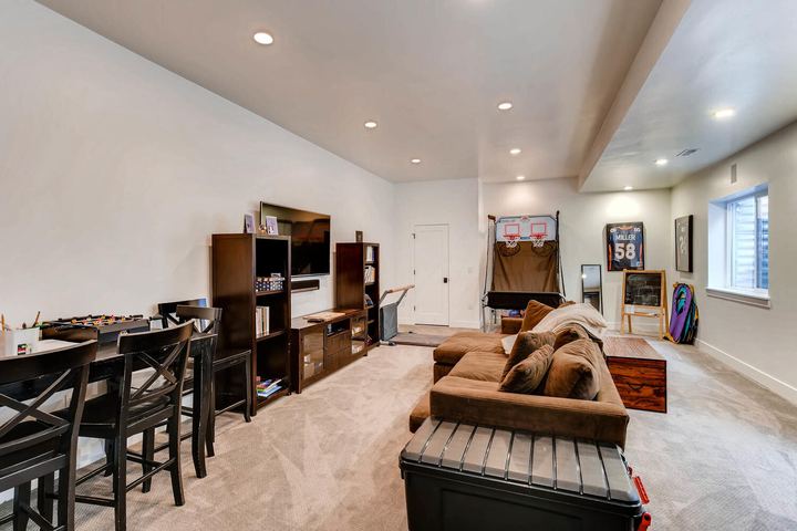Lower Level Family Room of a Caliber custom home at 1379 S Lafayette St in Denver