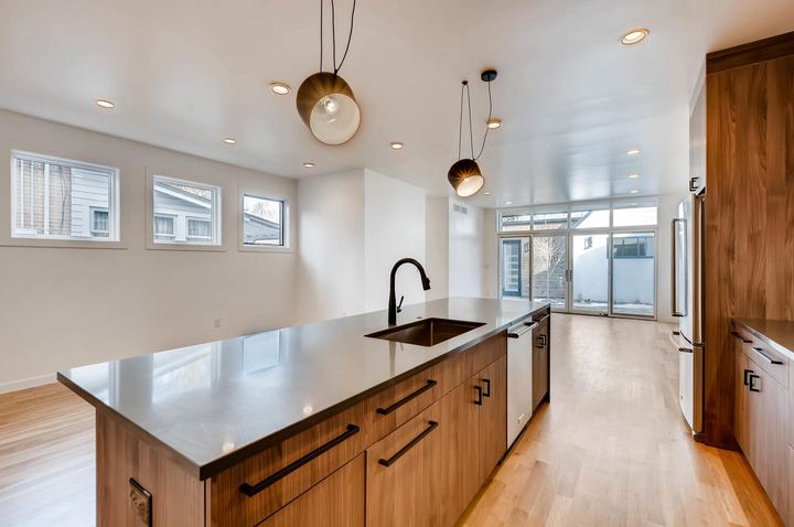 Kitchen of a Caliber custom home at 1442 S Clarkson St in Denver