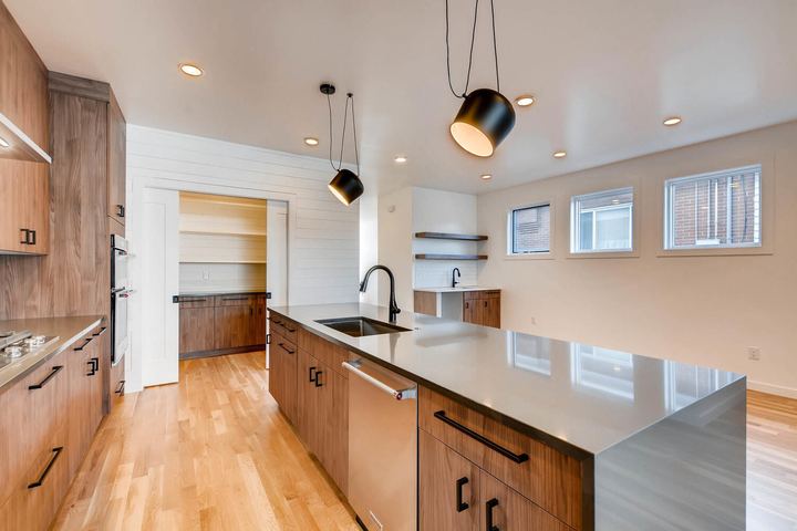 Kitchen of a Caliber custom home at 1442 S Clarkson St in Denver