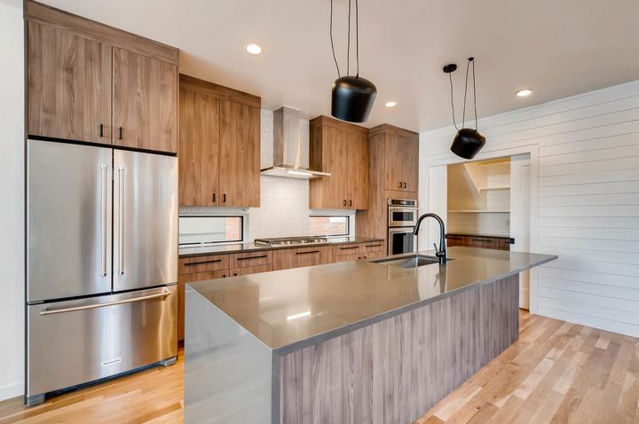 Kitchen of a Caliber custom home at 1442 S Clarkson St in Denver