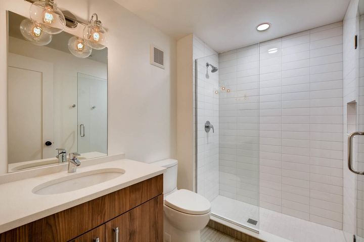 Lower Level Bathroom of a Caliber custom home at 1442 S Clarkson St in Denver