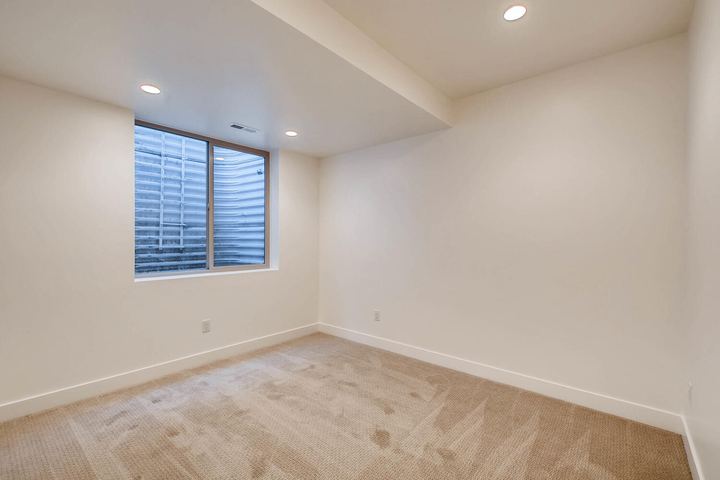 Lower Level Bedroom of a Caliber custom home at 1442 S Clarkson St in Denver