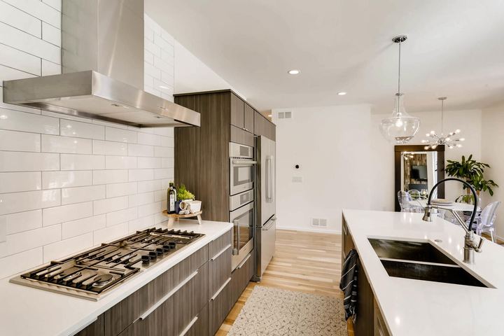 Kitchen of a Caliber custom home at 1716 W 34th Ave in Denver