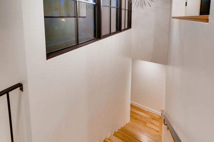 Stairway of a Caliber custom home at 2010 S Clarkson St in Denver