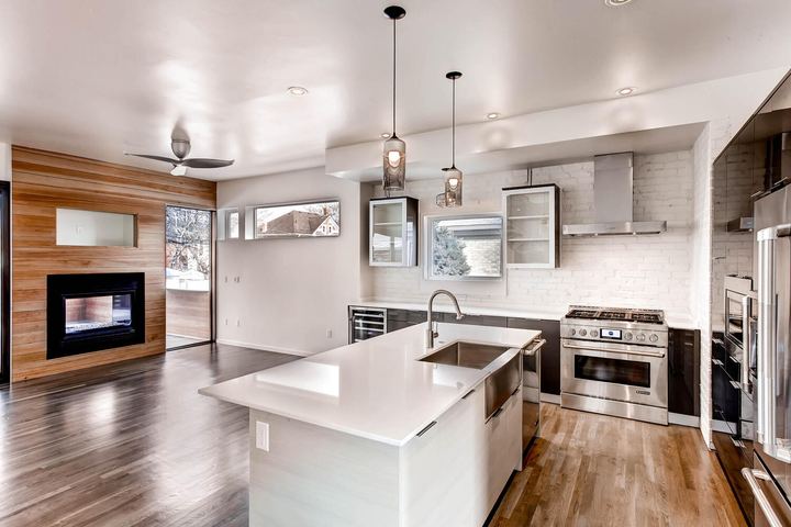 Kitchen of a Caliber custom home at 2329 W 32nd Ave in Denver