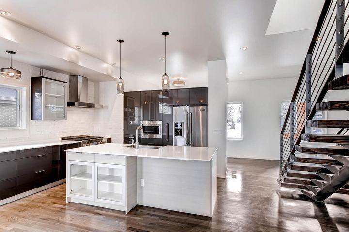 Kitchen of a Caliber custom home at 2329 W 32nd Ave in Denver