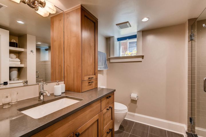 Lower Level Bathroom of a Caliber custom home at 532 N High St in Denver