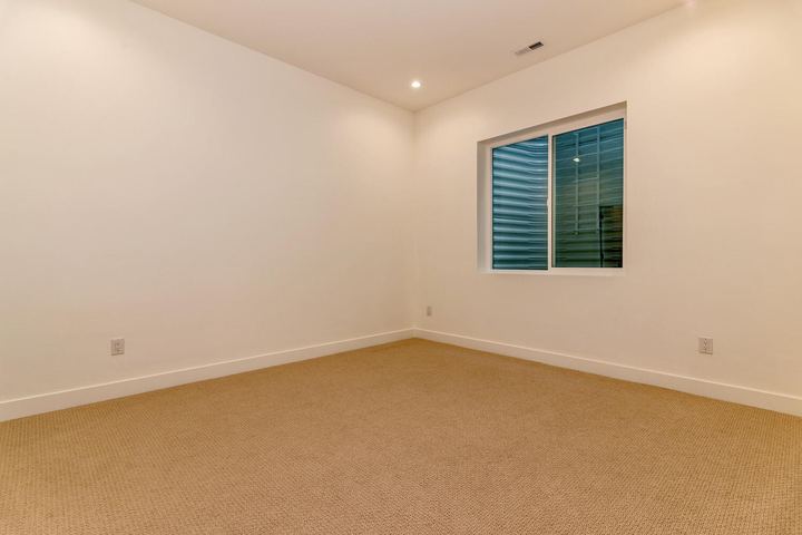 Bedroom of a Caliber custom home at 610 S Race St in Denver