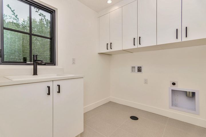Laundry of a Caliber custom home at 610 S Race St in Denver